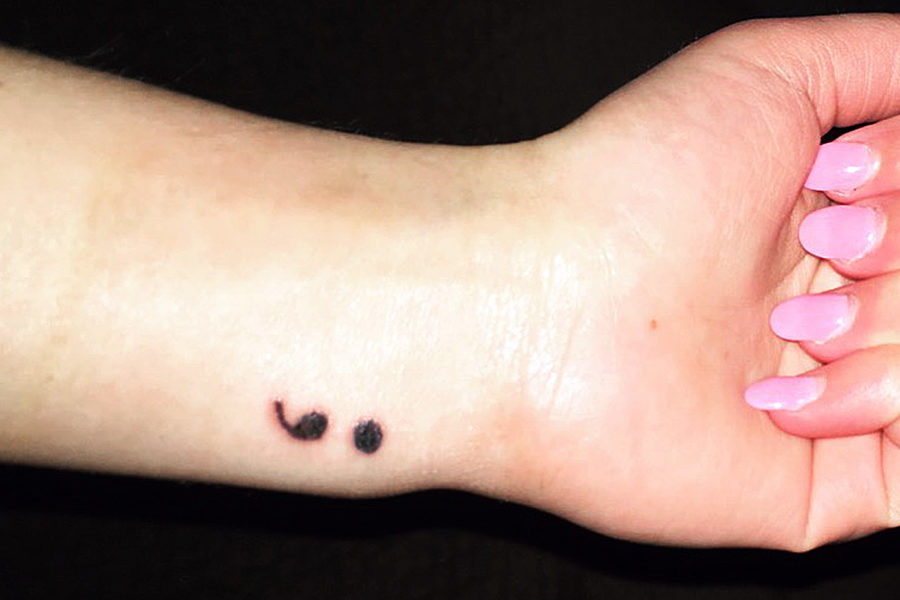 Former staff member Jordan Toomey chose to get a semi-colon tattoo on her wrist where she once self-harmed. The tattoo symbolizes the fact that she chose to pause her story, not to end it. 