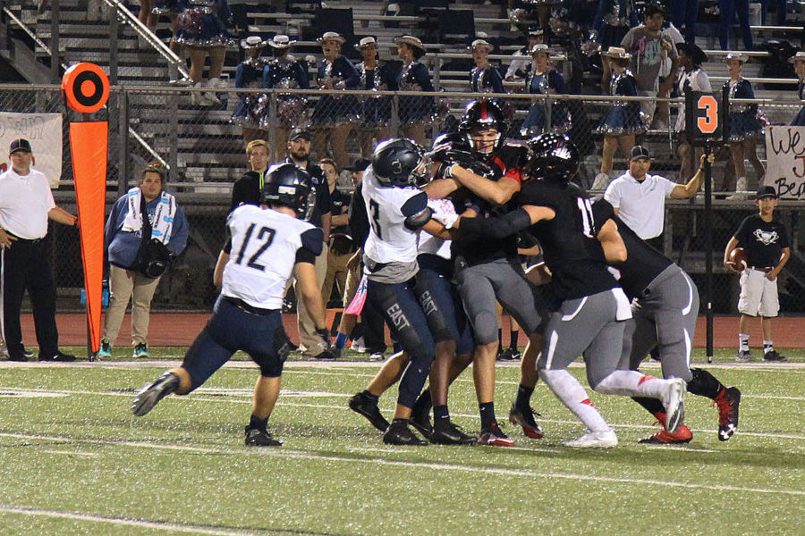 Senior Anthony Vogel fights for hold of the ball in the 3rd quarter against Wylie East.