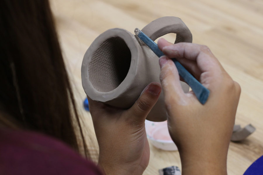 Sculpture students are creating mugs and dog bowls to benefit Operation Kindness.