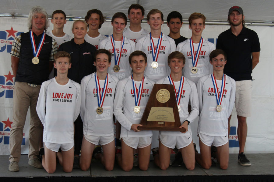 Varsity runners and alternates pose on the UIL State podium.