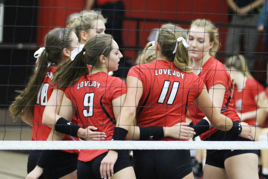 Seniors Callie Holden, Paige Becker, Taylor Carty, Bailey Downing, and Haley Deschecnes huddle on the court during Senior Night versus Royse City.