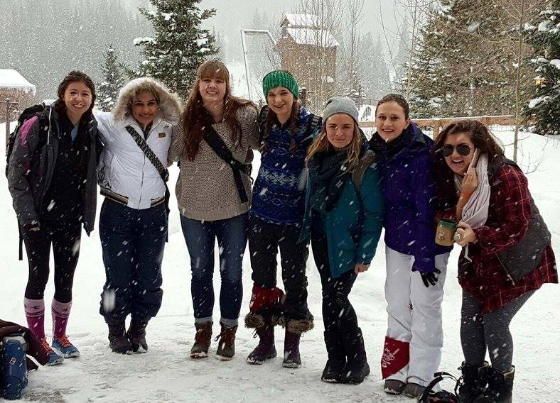 Ellie Hager, Jillian Sanders, Katy Park, and Allen Younglife students pose at the basin of the Winter Park Ski Resort on last year's ski trip. 