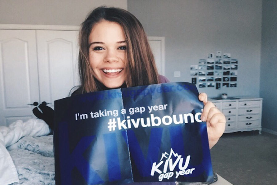 Ellie Stockton holds her acceptance poster from the KIVU Gap Year Program