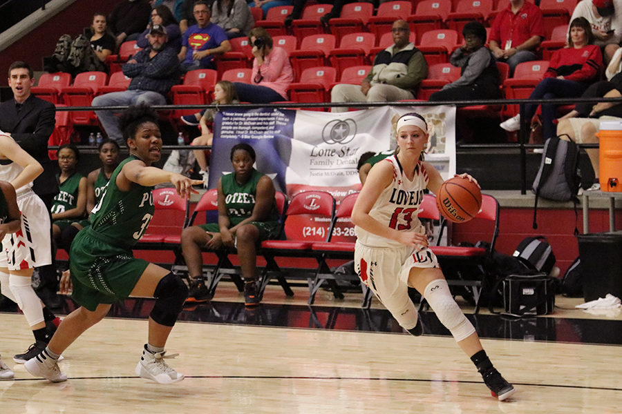 Taylor Meixelsperger drives down the baseline against a Mesquite Poteet defender. 