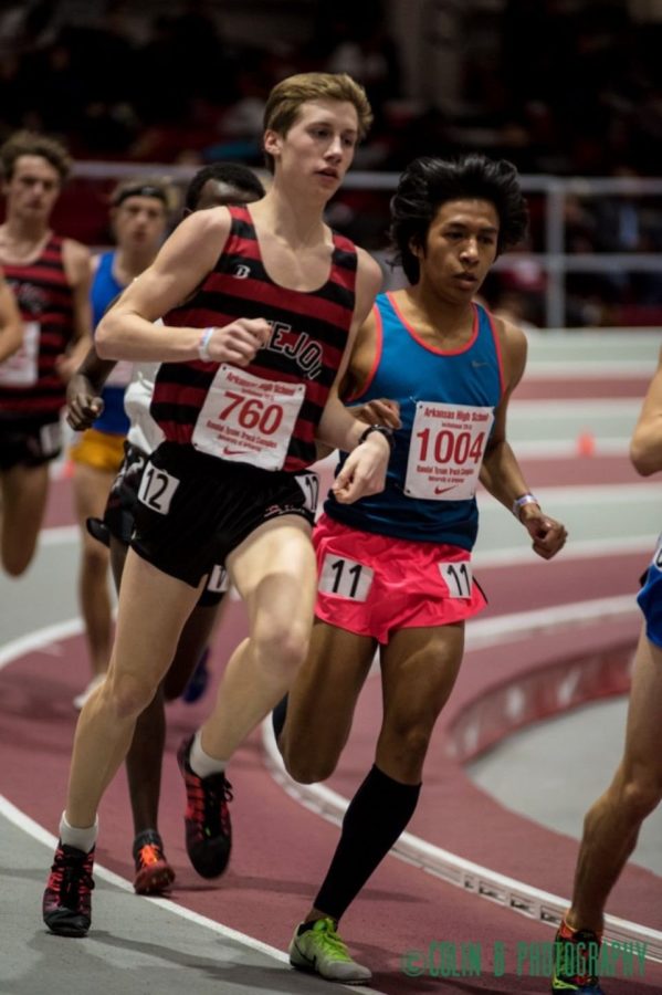 Junior Ryan Brands at the University of Arkansas indoor track last year. Both short and long distance athletes will be competing on the 200m track.