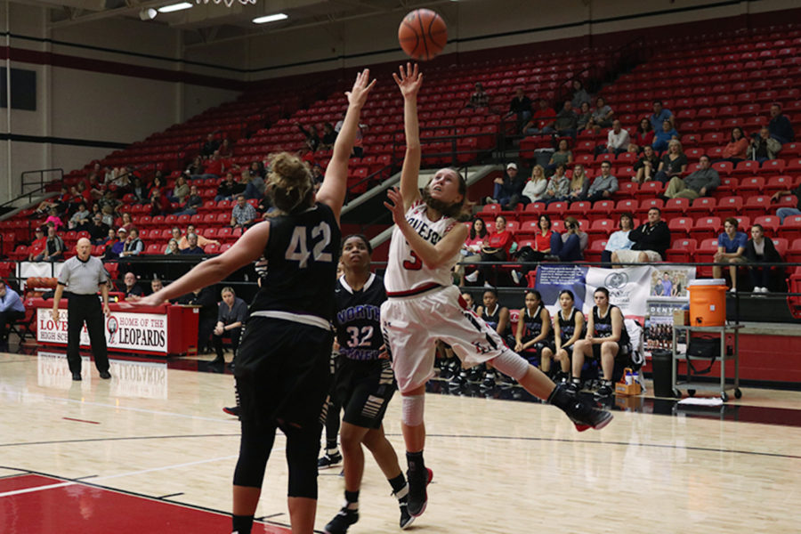 Junior Meredith Ehlmann shoots during game against North Forney.