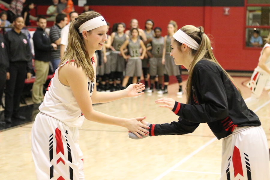 Guard Taylor Meixelsperger and foward Meredith Welch come together to do their pregame handshake. 