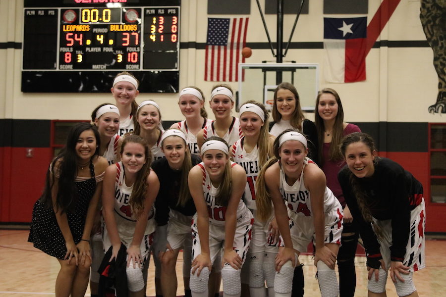 The entire varsity girls team comes together after a decisive victory against Royse City on senior night.