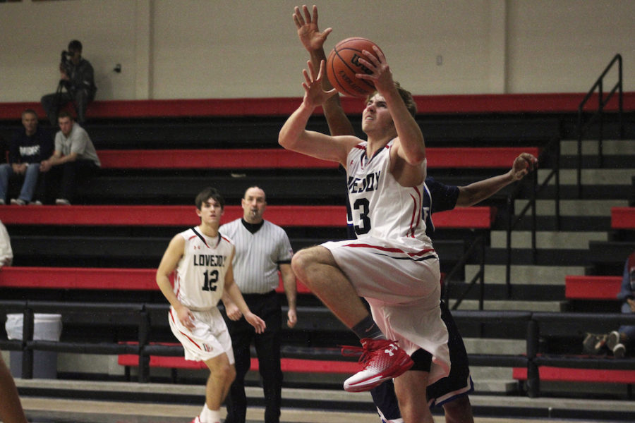 Sophomore Kyle Olson goes for lay up.