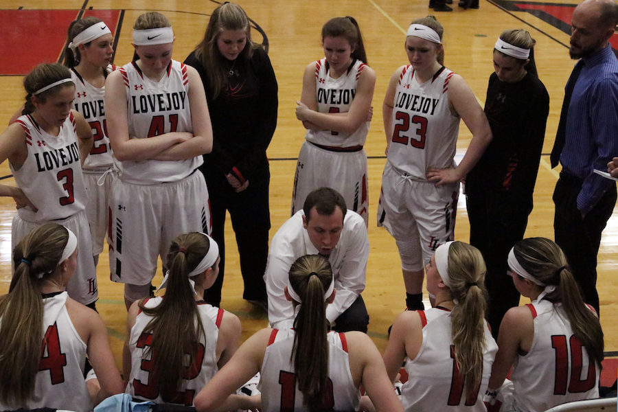The team huddles during a timeout to prepare for the next play.
