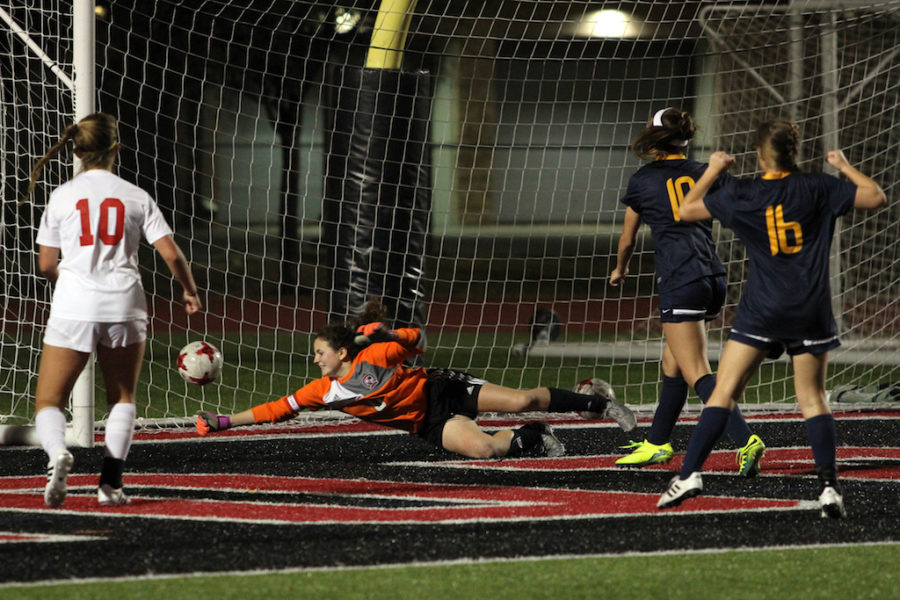 Senior Carolyn Murad dives to save the ball from going in.