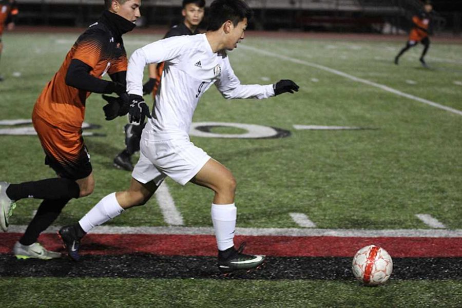 Sophomore Christian Kwon runs down field.