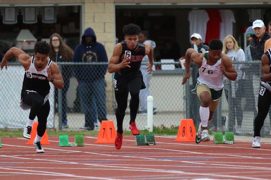 Senior Chase Van Wagoner sprints in the 100 meter event.