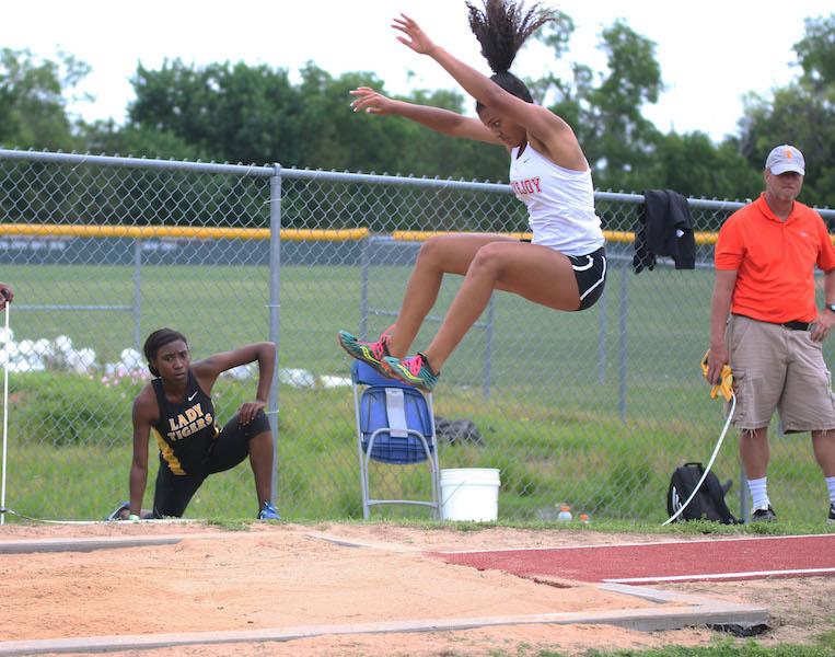 Junior Shanel Bramschrieber competes in the long jump.