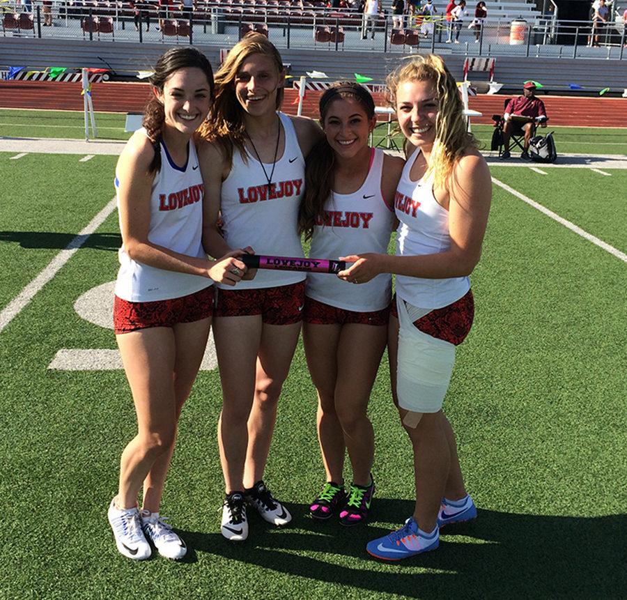 Sophomore Kassidy Litchenberg, junior Grace Ridgeway, senior JoJo McRae, and 2016 grad Riley Gournay hold the baton from a relay during the 2015-16 school year.
