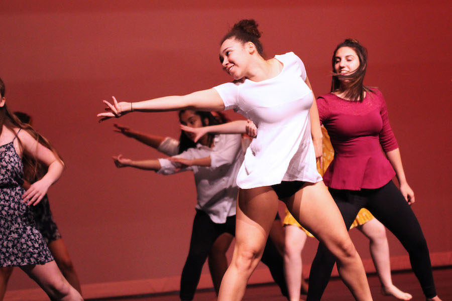 Junior Alyssa Seay and sophomore Camille Morgello dance in the opening performance. 