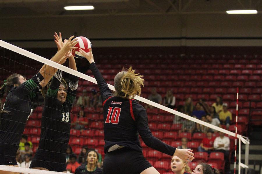 Senior Madison Waters tips the ball over the net in a contest against Southlake Carroll last season.