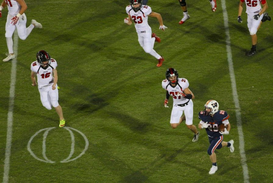 Lovejoy special teams looks to tackle the Wakeland returner.