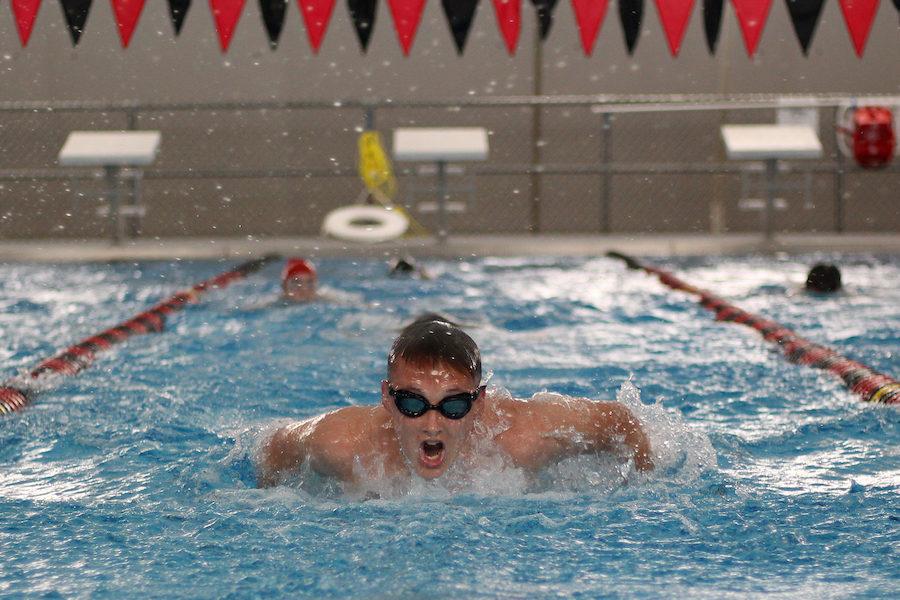 Sophomore Ross Walenciak swims butterfly during a stroke set at morning practice. 