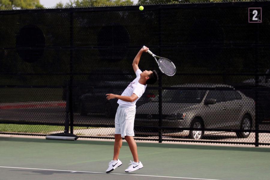 Junior Daniel Xue practices his jump serve in preparation for a matchup against Wylie East.