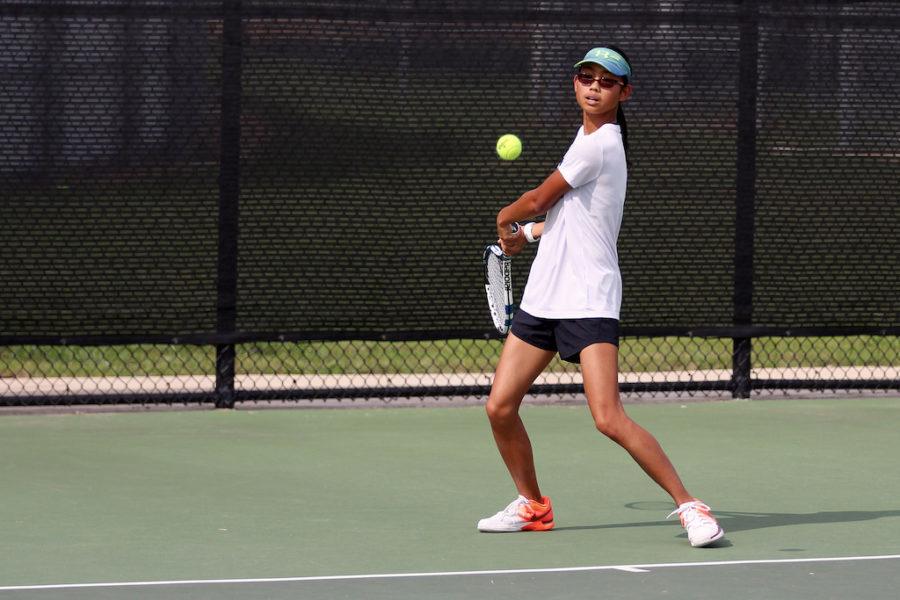 Freshman+Kelly+Zhang+practices+her+backhand+during+practice+to+prepare+for+Forney.+