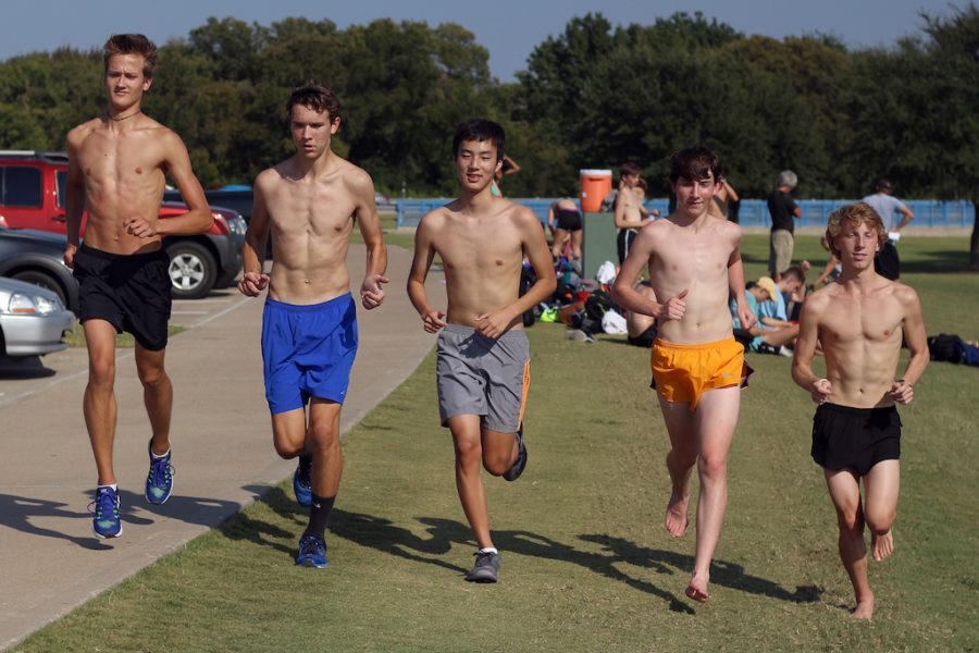 Boys team runners from sophomores to seniors cooling down after a run.