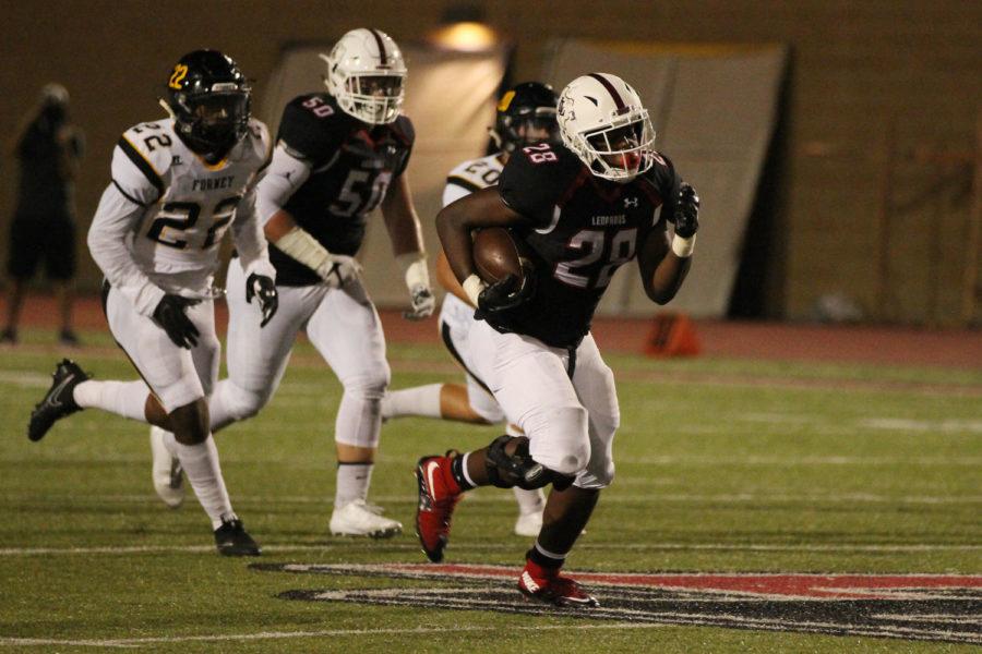 Junior Jahi Rainey makes a run for a touchdown.