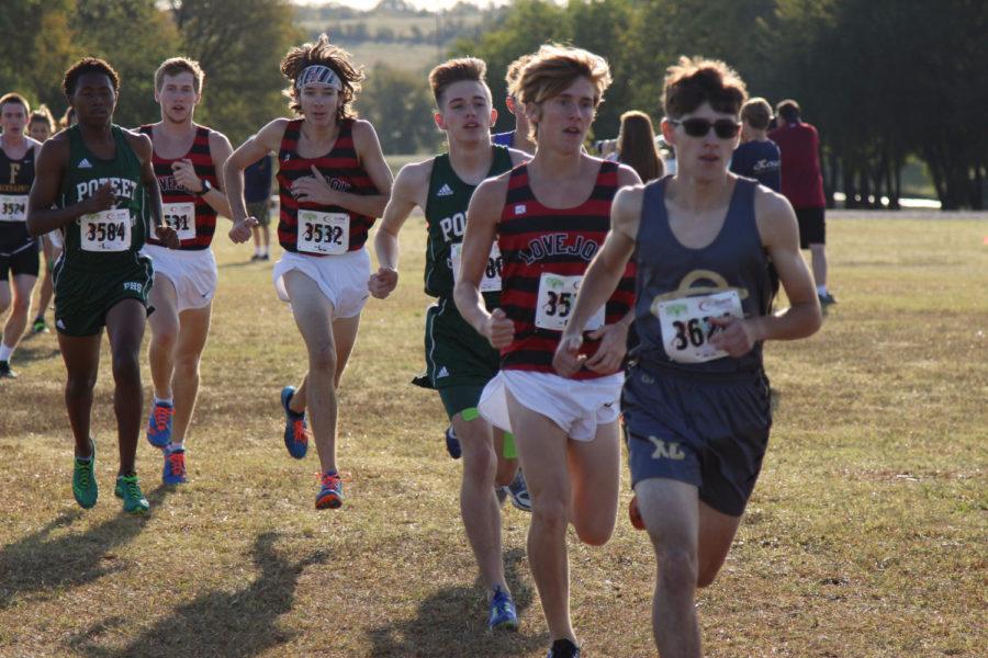 Sophomore Brady Laboret and seniors Bradley Davis and Ryan Brands keep pace with the Mesquite Poteet runners.