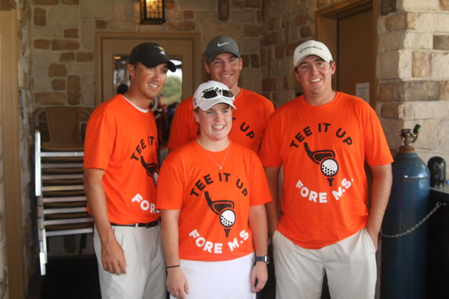 Senior Savanna Roulette stands with participants at the charity tournament