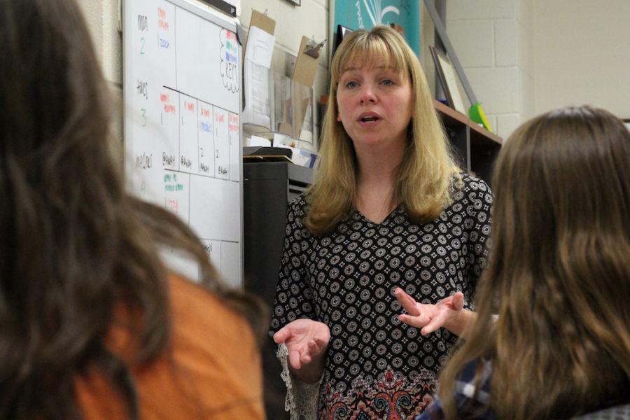 New yearbook instructor Rebecca Pollard outlines the years deadlines with her editors.