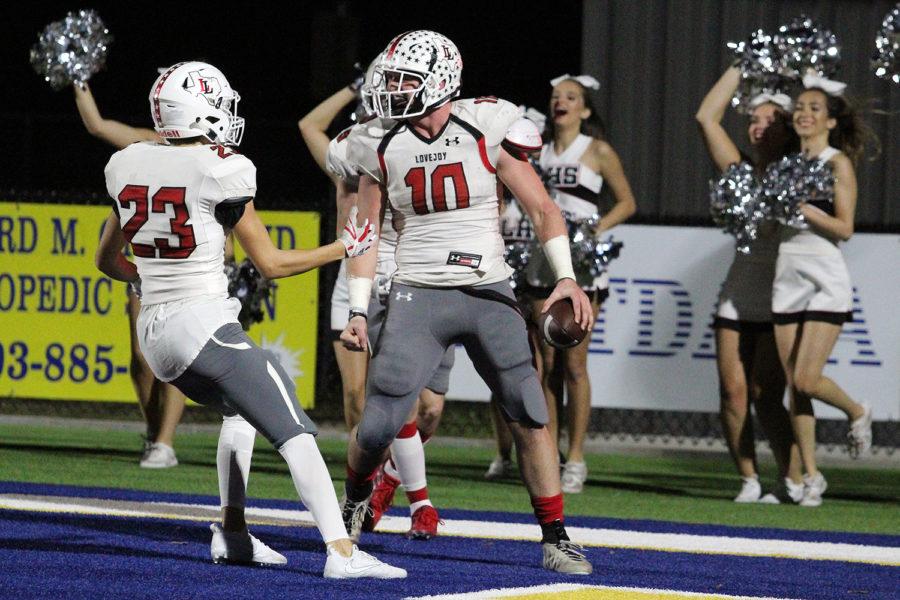 Carter Griffith [23] celebrates with teammate Bumper Pool [10] after a touchdown against Sulphur Springs in last Fridays first round playoff game. Pool scored two rushing touchdowns in the 45-29 road win.