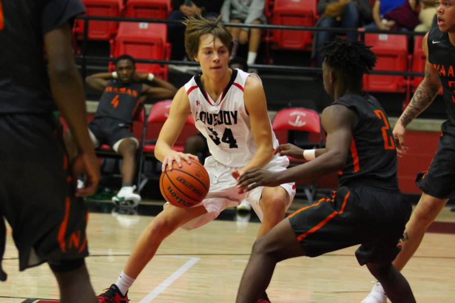 Junior Trevor Hawley makes a maneuver to the post.