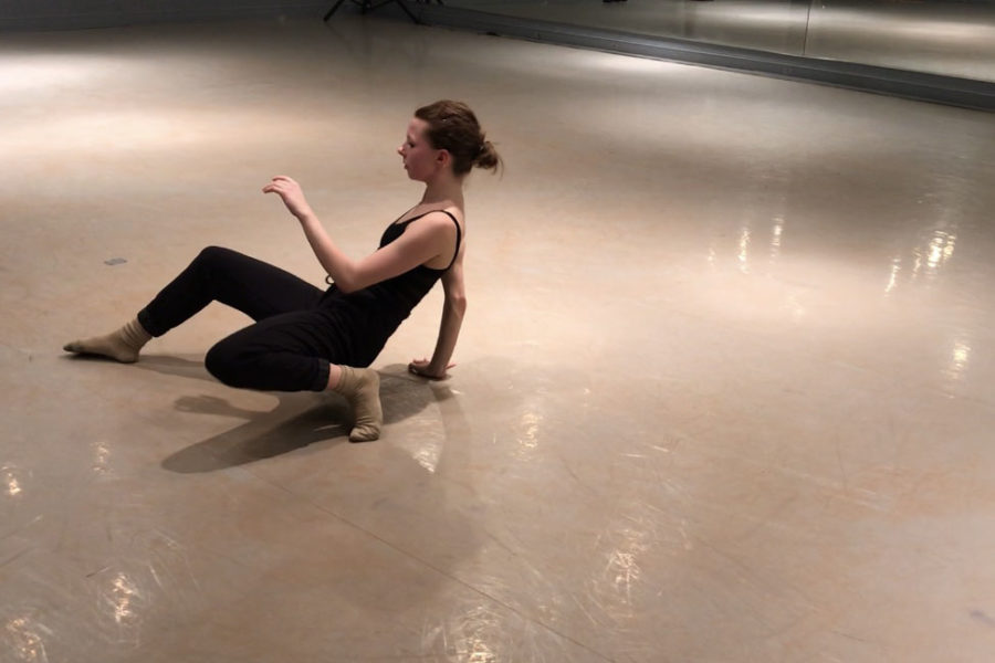 Senior Katelyn Cummings rehearses solo in a dance studio to breakdown each movement. 