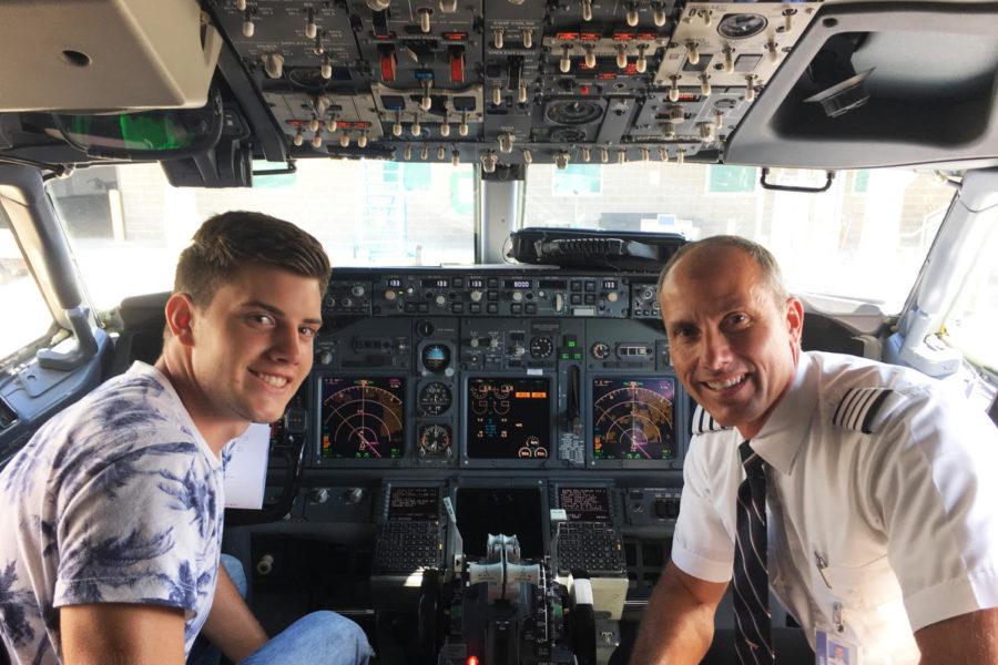 Matt Harris (left) and his father Jeff (right) sit the cockpit of a plane piloted by Jeff.