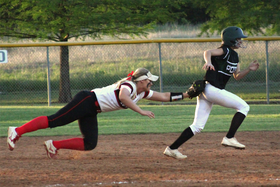 Senior Alyssa Difiore gets runner into a rundown and successfully tags her out in a game against Mesquite Poteet.