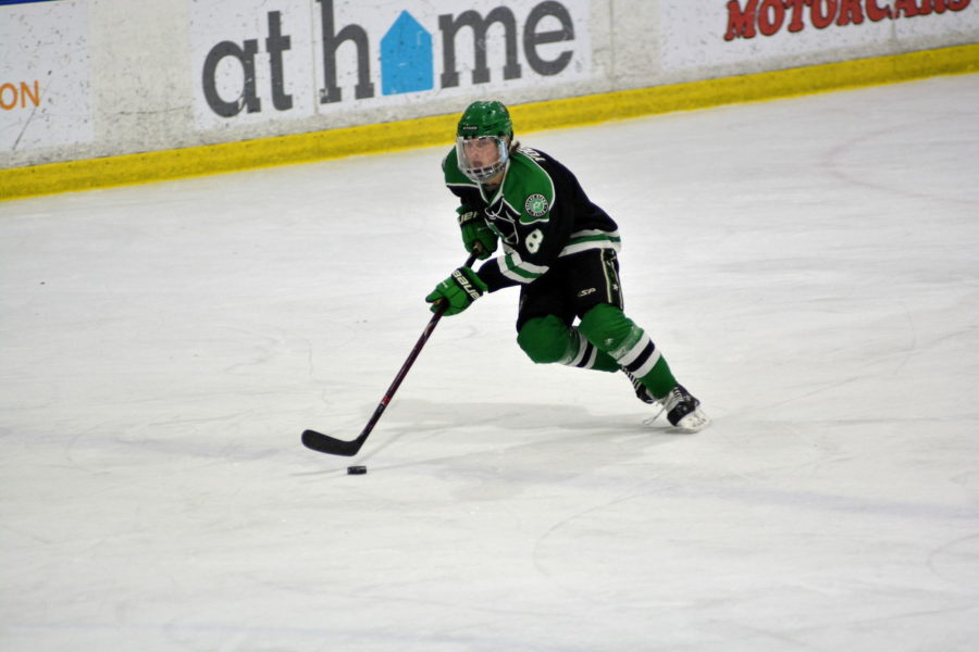 Sophomore Chase Yoder enters the zone in a game with the Dallas Stars 16UAAA team.