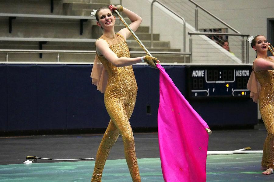 Junior Isabel Marsden holds her flag during competition.