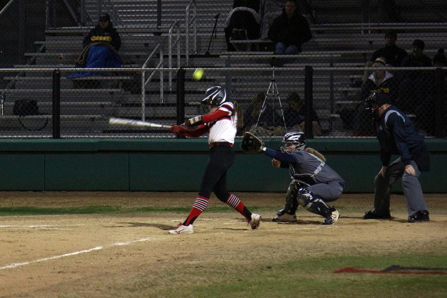 Junior Delaney Dicristofaro takes a swing at a fastball.