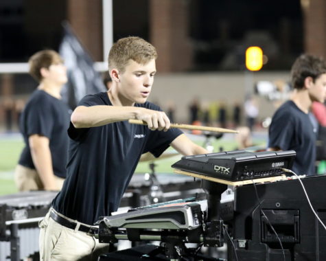 Junior Matthew Franks performed in the front ensemble during the Frisco Heritage football game.