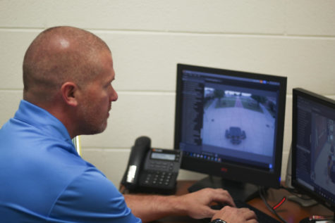 Campus security officer Casey Littlefield monitors the courtyard via security cameras.  
