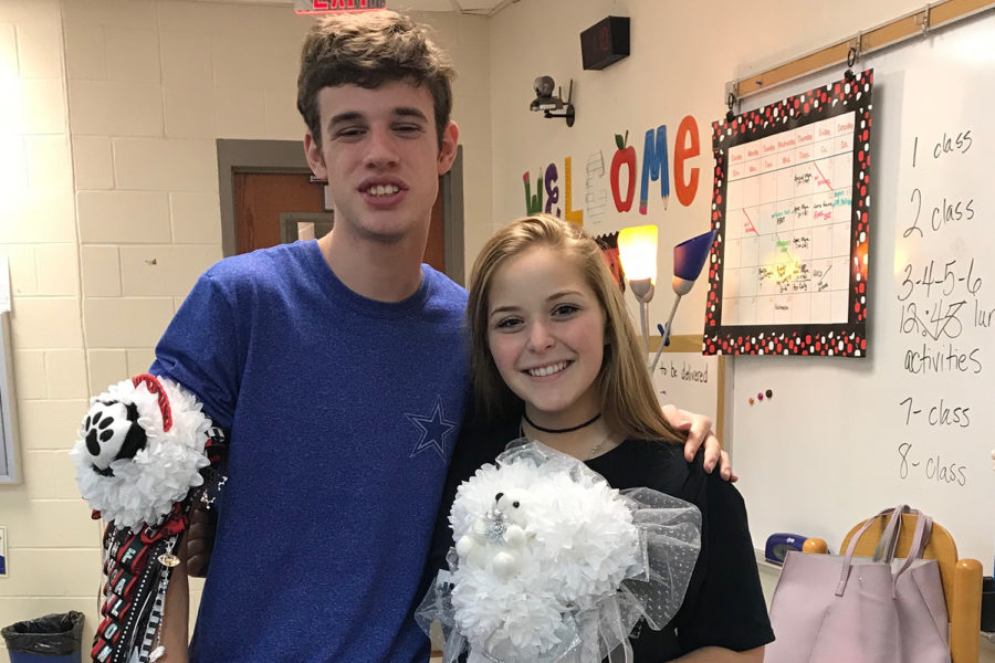 Sophomore Falon Simmons poses with his Homecoming date, senior Aubrie Shinedling, on Thursday.