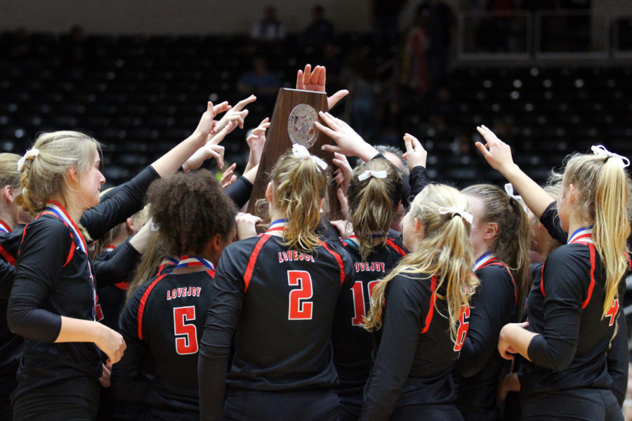 The Leopards come together to raise the state runner-up trophy after Saturdays championship match in Garland.