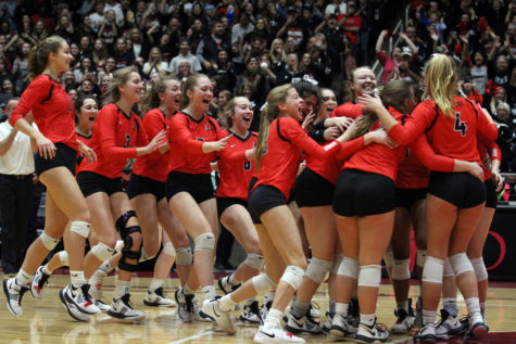 The Leopards celebrate on the court after winning their semi-final game against Dripping Springs Friday at the Curtis Culwell Center in Garland.