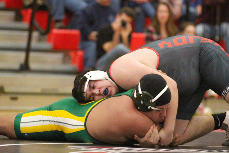 Junior Grant Sessions looks to lock down his opponent.