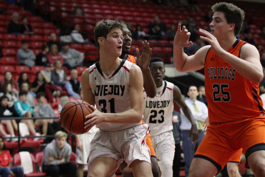 Senior Luke Ledebur attempts a pass to his teammate during last Fridays game. 