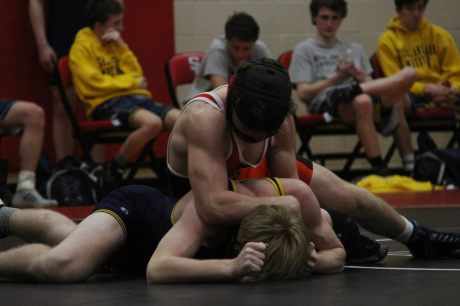 Lovejoy wrestler pins his opponent.
