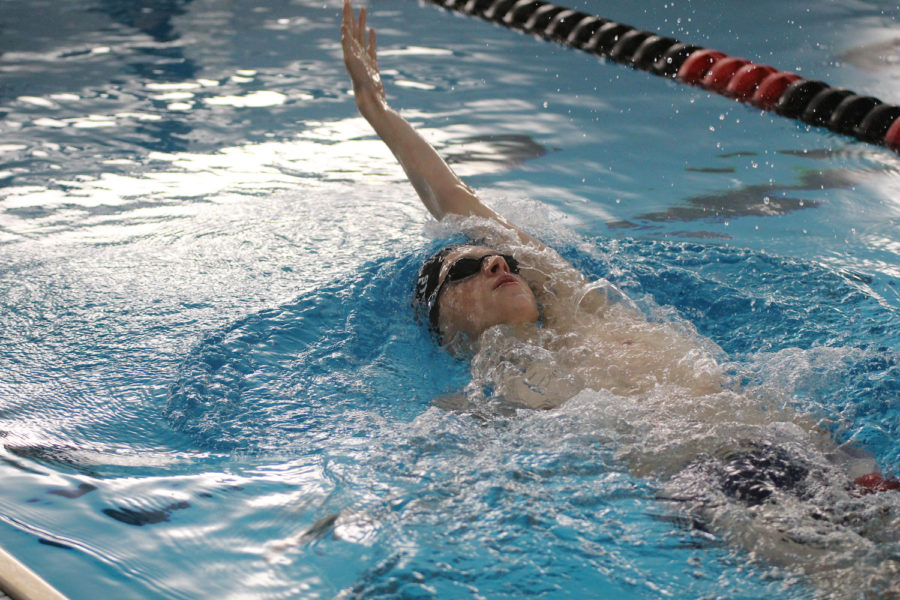 Senior Jed Jones practices his backstroke. Jones looks to defend his state title in the 200 IM
