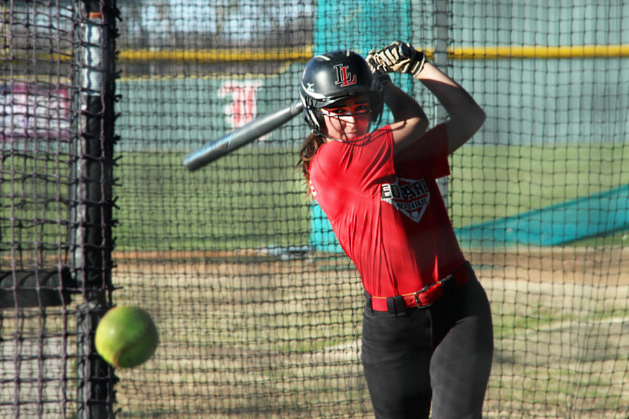 Junior+Carlee+Schaeffer+takes+a+swing+in+the+batting+cage.