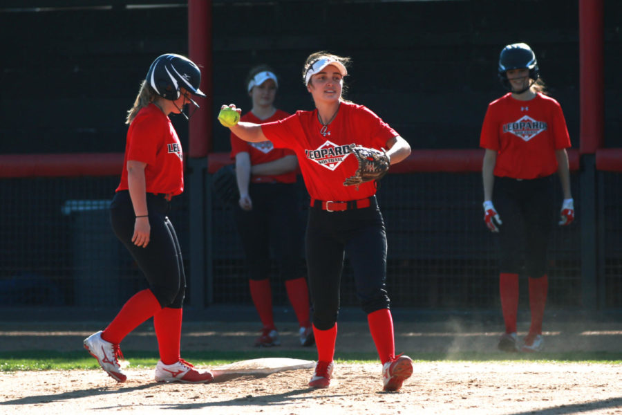 Junior+Carlee+Schaeffer+gets+an+out+from+a+throw+by+senior+Delaney+Dicristofaro+during+a+first+and+third+base+situation.+