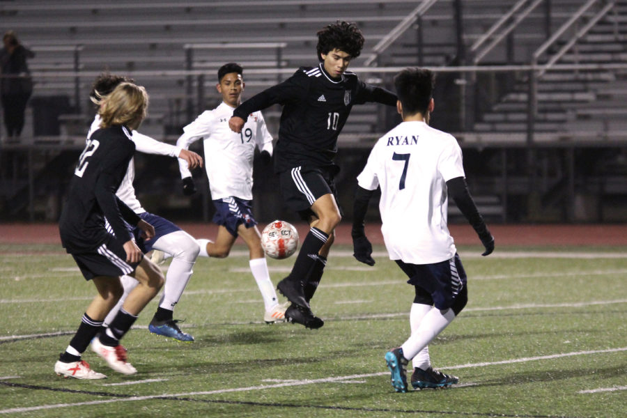 Junior Diego Rodriguez attempts to block a pass between two Wylie East teammates. 